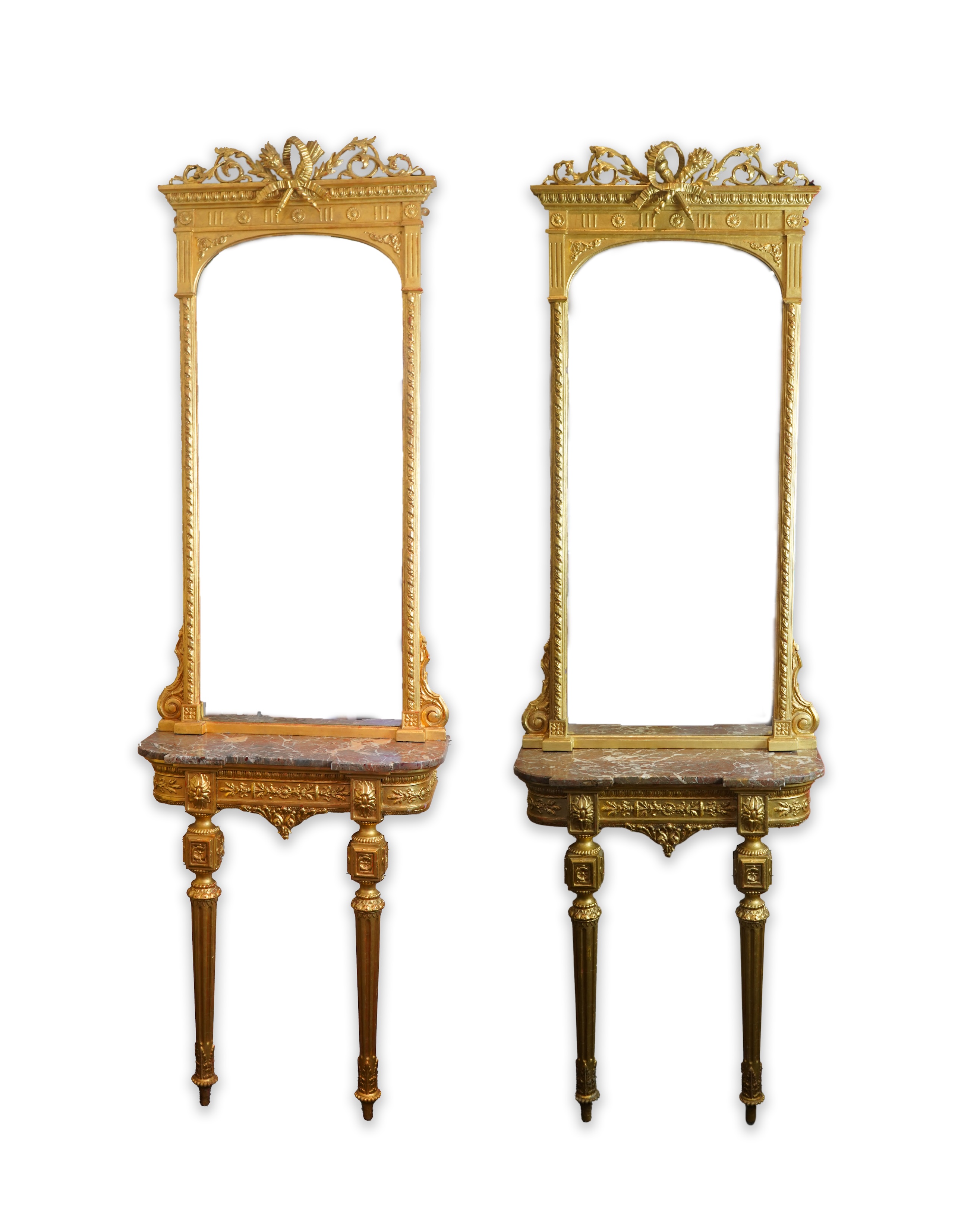 A pair of Louis XVI style giltwood and composition marble topped pier tables and mirrors